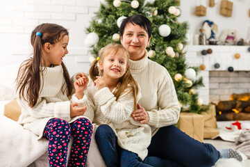 mother and children at home for christmas