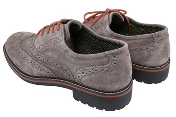 a pair of light brown suede shoes, on a white background, viewed from the side of the heel