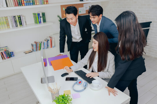 Group of young business people working together in modern office, Business colleague discussing looking and doing video conference on computer
