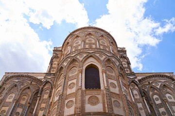 Fototapeta premium The exterior view of the apse of the Cathedral of Santa Maria Nuova in Monreale. The church is a Unesco World Heritage Site and is in Arabic Norman Byzantine style. It is located on Sicily, Italy.