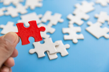 Human hands holding jigsaw  with word problem & solution.  symbol of association and connection. business strategy.