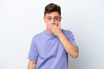 Fototapeta premium Young handsome Brazilian man isolated on white background covering mouth with hand