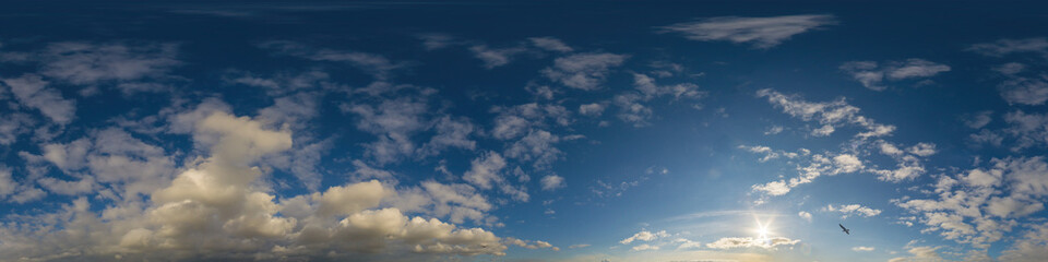 Panorama of a dark blue sunset sky with golden Cumulus clouds. Seamless hdr 360 panorama in spherical equiangular format. Full zenith for 3D visualization, sky replacement for aerial drone panoramas.