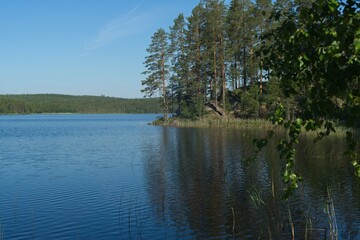 Fototapeta na wymiar A lake with a nice little beach for swimming.