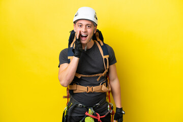 Young rock climber Brazilian man with surprise and shocked facial expression
