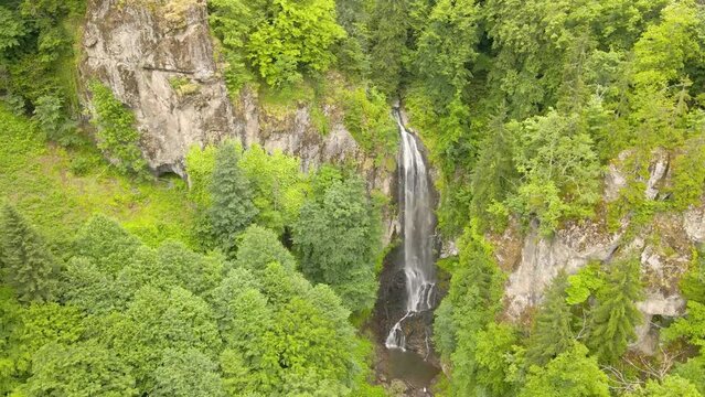 Drone shot of the waterfall Merisi. drone flies over waterfall and forest.Georgia. 