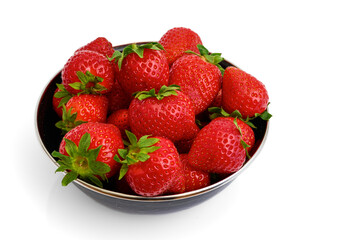 a black bowl filled with red fresh strawberries