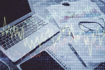 Forex market chart hologram and personal computer background. Double exposure. Concept of investment.