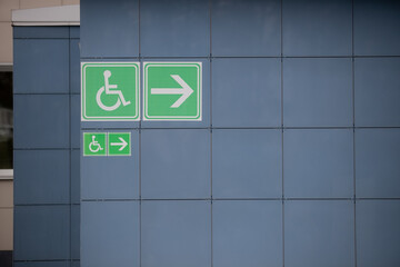 Sign of entrance to a public subway for disabled people.