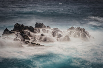 Porto Moniz - Long exposure of rocks and waves at vulcanic coast - beautiful landscape scenery of Madeira Island, Portugal. October 2021