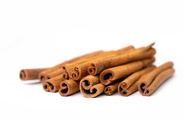 Cinnamon sticks on white background isolated. Indian spices close up. Medicinal herbs and spices.