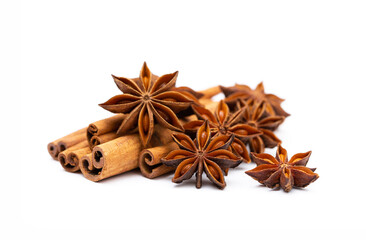 Star anise and cinnamon sticks on a white background isolated. Indian spices close up. Medicinal herbs and spices.