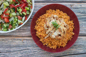 Traditional Turkish food; Chicken tandoori on bulgur pilaf (Turkish name is tandoori chicken on bulgur pilaf)