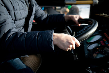 transport, transportation, tourism, road trip and people concept - close up of bus driver driving...