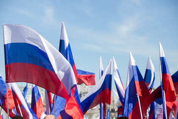 Russia flag isolated on the blue sky with clipping path. close up waving flag of Russia. flag...