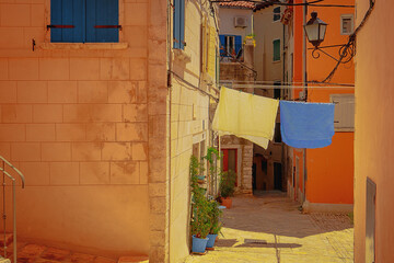 One of the small alleys in the old, colorful Mediterranean town of Rovinj, Croatia.