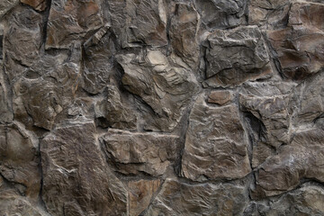 The texture of a stone wall. Stone wall background . A stone wall as a background or texture. Part of a stone wall for background or texture.