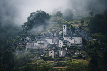 Ancient village of Corippo situated near Lavertezzo on a hill surrounded by forest and mountains in...