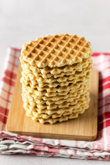 Stack of Tasty Waffles on Wooden Kitchen Board Homemade Healthy Breakfast Light Concrete Background Dessert Vertical