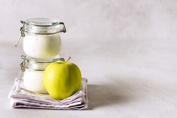 Yogurt in Glass Jar on Linen Napkin White Yoghurt Tasty and Healthy Breakfast Copy Space