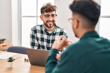 Obraz premium Young couple business workers speaking at office