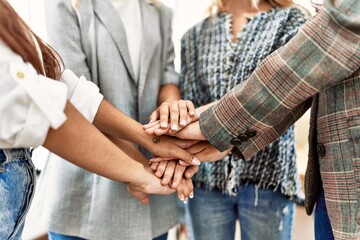 Obraz premium Group of young businesswoman standing with hands together at the office.