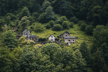 View on the Lavertezzo village, famous tourist destination - An old Swiss village with double arch stone bridge at Ponte dei Salti with waterfall, Lavertezzo, Verzascatal, Canton Tessin