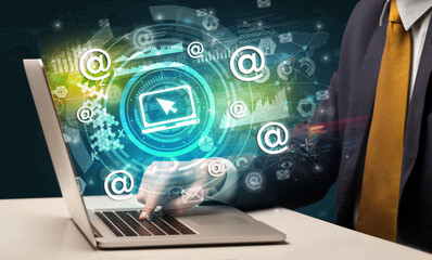 Business hand typing on a modern laptop