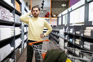 the buyer in the store is puzzled by the choice of finishing materials for the walls