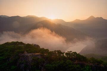 Scenic view of mountains against sky during sunrise