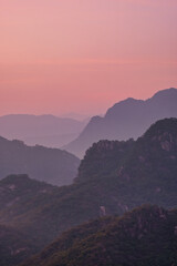 Scenic view of mountains against sky during sunrise