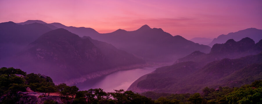 Scenic view of mountains against sky during sunrise