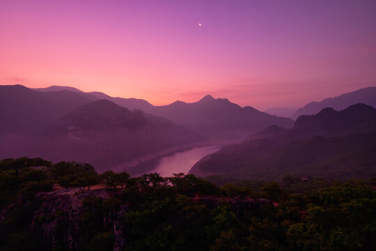 Scenic view of mountains against sky during sunrise