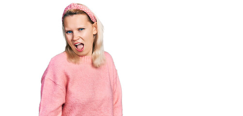 Young caucasian woman wearing casual clothes winking looking at the camera with sexy expression,...