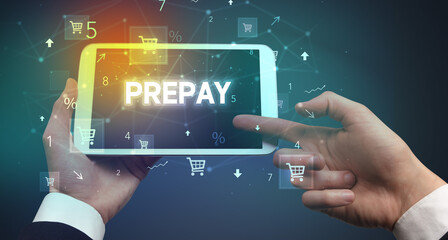 Close-up of a hand holding tablet with shopping inscription