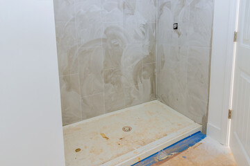 Fototapeta na wymiar For the new home, of process building a bathroom has been installed in a shower