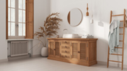 Blurred background, classic vintage bathroom, rattan wooden washbasin, chest of drawers, mirror, towel rack and decor. Parquet and window with shutters. Modern interior design