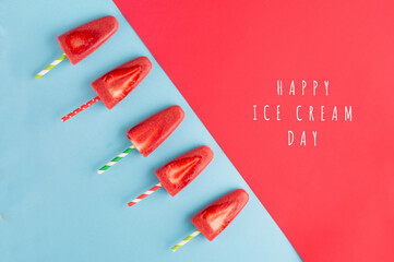 Strawberry popsicles with fresh slices. National ice cream day july 17 holiday concept.