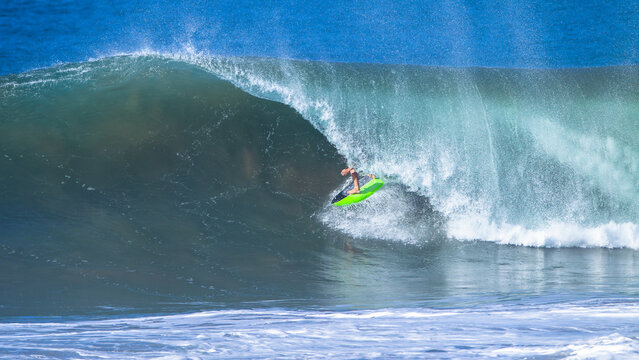 Surfer Surfing Inside Ocean Wave Tube Ride Challenge