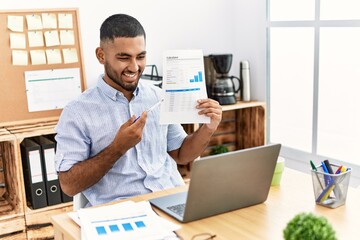 Young middle east man smiling confident having video call at office