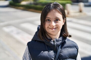 Young woman with down syndrome smiling confident standing at street