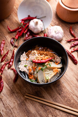 Thai Noodle , Bowl of noodles with spices on wooden background, Thai noodles soup, Table top view