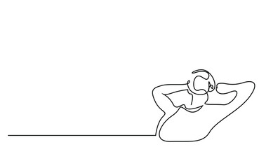 a young man puts his hands behind his head and rests relaxed