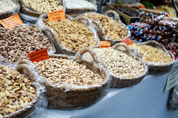 A stall selling a variety of nuts and dried fruit at the Alicante fogueras festivities flea market.