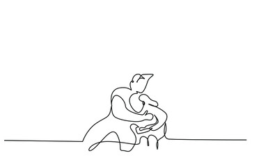 a father hugs and comforts his sad crying son