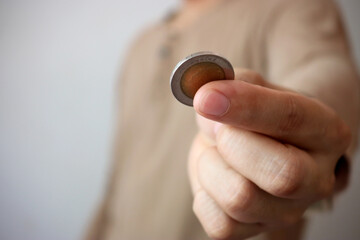 Coin in hand - thai baht. Finance and expenses concept