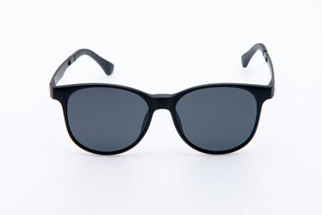 Fashion sunglasses black frames on white background.