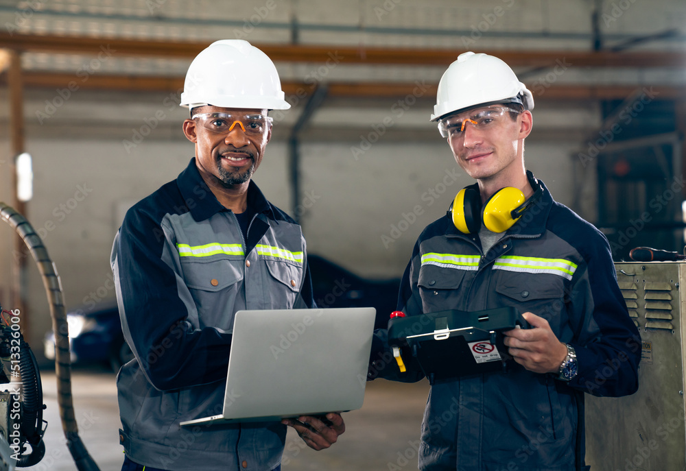 Poster two factory workers using adept machine equipment in a workshop . industry manufacturing and enginee