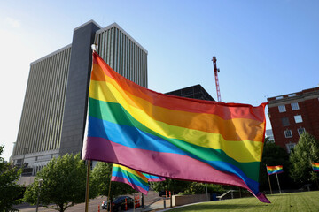Pride flag blowing in the wind downtown