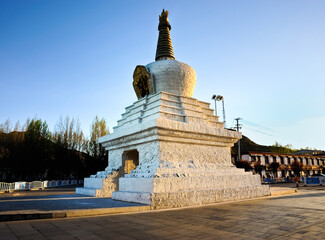 A white Buddhist stupa or pagoda in a Tibetan monastery, Tibet.